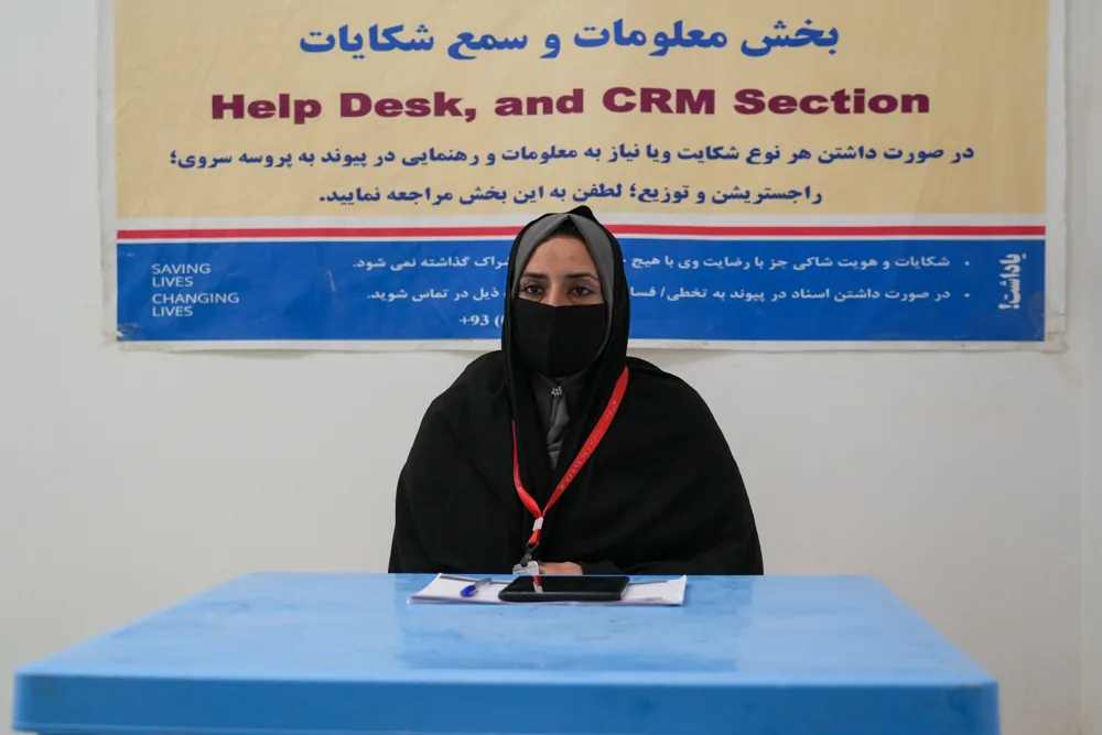 FSCWEO staff member at the community help desk and feedback section